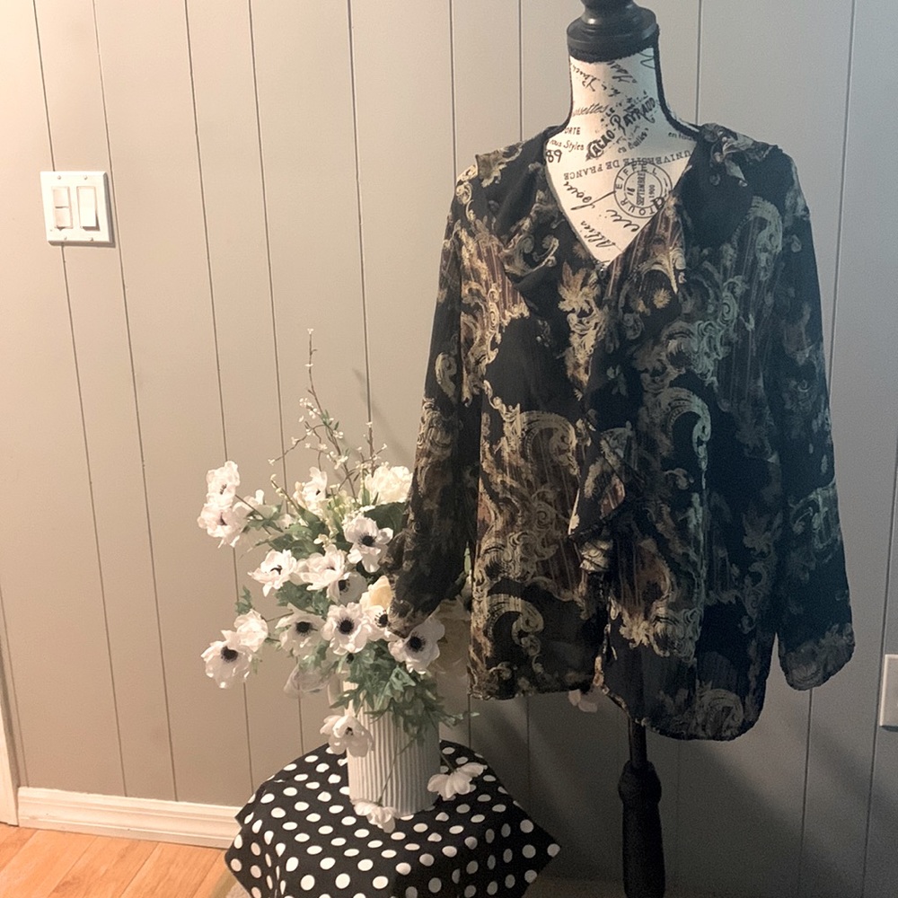 Polyester chiffon blouse. Button down the front.